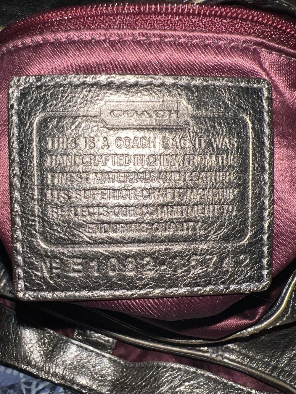Coach Madison Maggie hobo shoulder bag featuring a metallic gunmetal leather